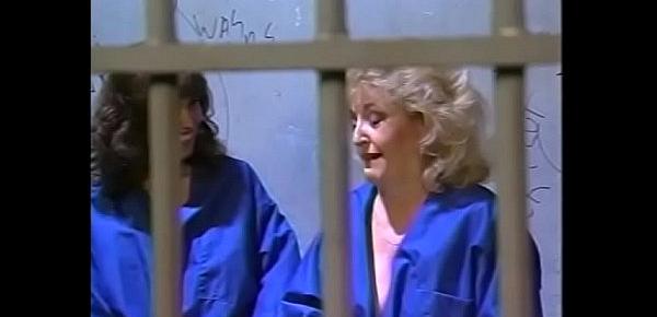  Couple of naughty couagars Carole Troy and Kitty Foxx continue to have some Sapphin fun even in the jail